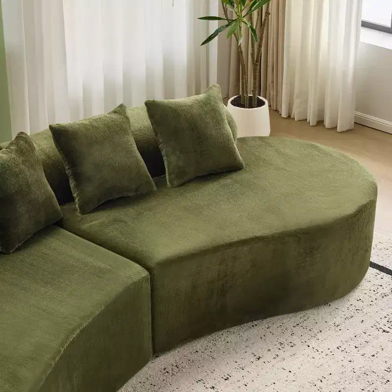 Modern and simple curved flannelette sofa. Creative multi-seater for the living room, with a combination of pillows.