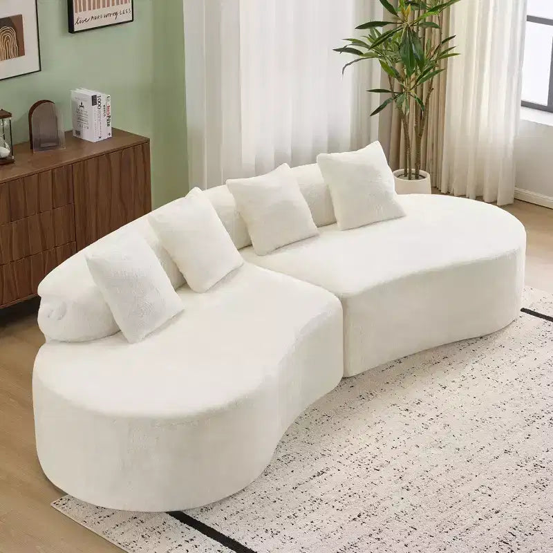 Modern and simple curved flannelette sofa. Creative multi-seater for the living room, with a combination of pillows.