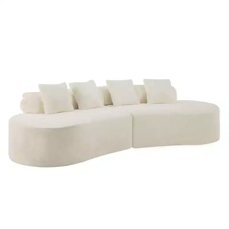 Modern and simple curved flannelette sofa. Creative multi-seater for the living room, with a combination of pillows.