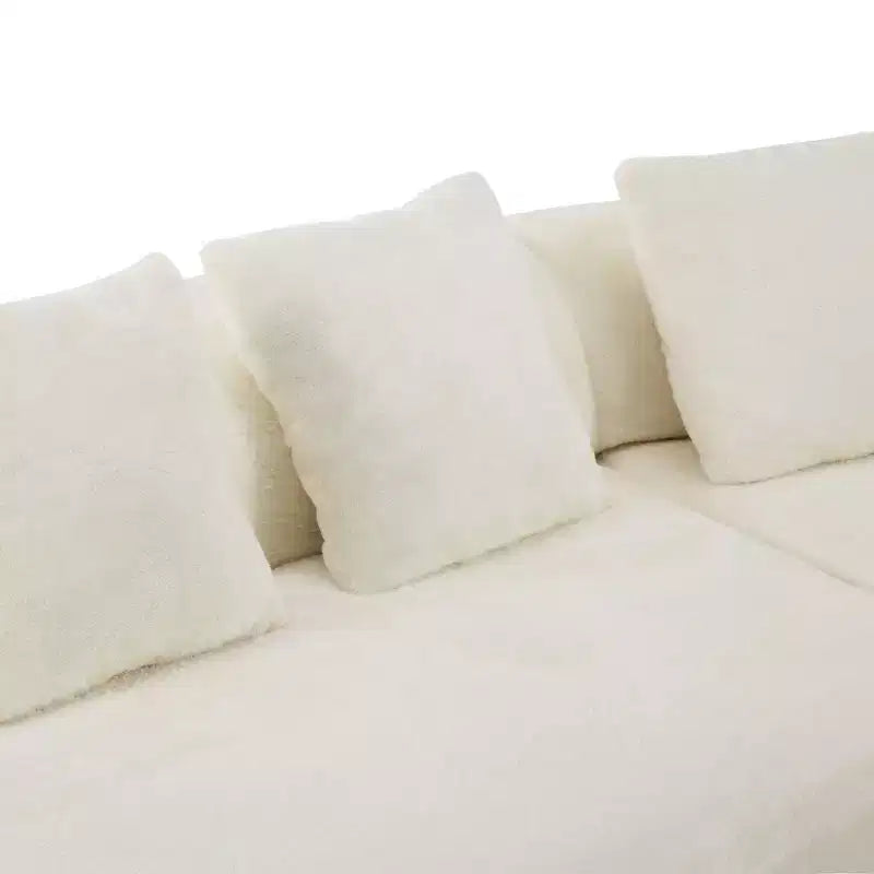 Modern and simple curved flannelette sofa. Creative multi-seater for the living room, with a combination of pillows.