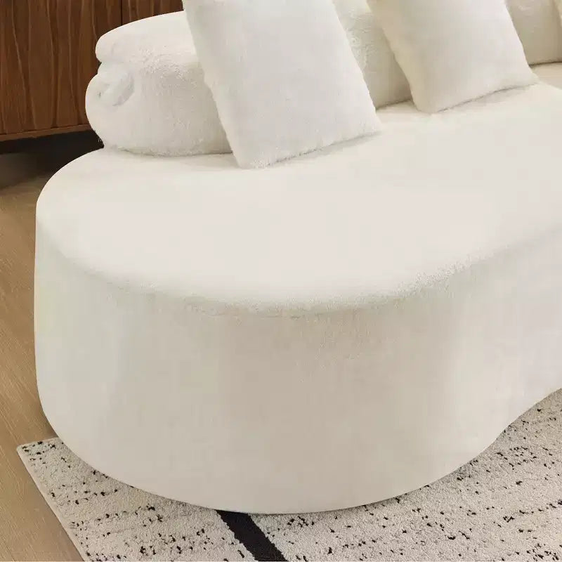 Modern and simple curved flannelette sofa. Creative multi-seater for the living room, with a combination of pillows.