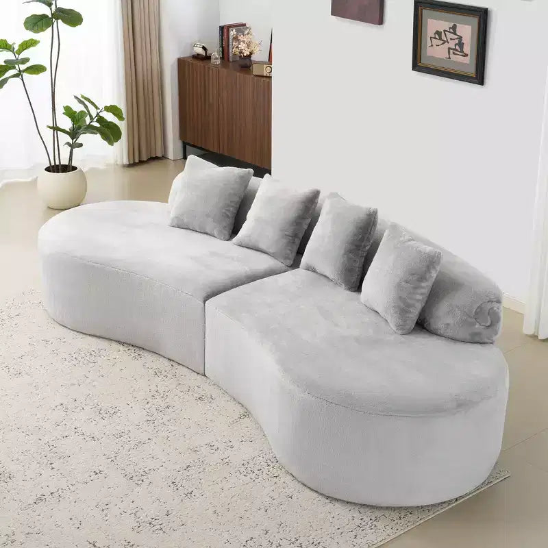 Modern and simple curved flannelette sofa. Creative multi-seater for the living room, with a combination of pillows.