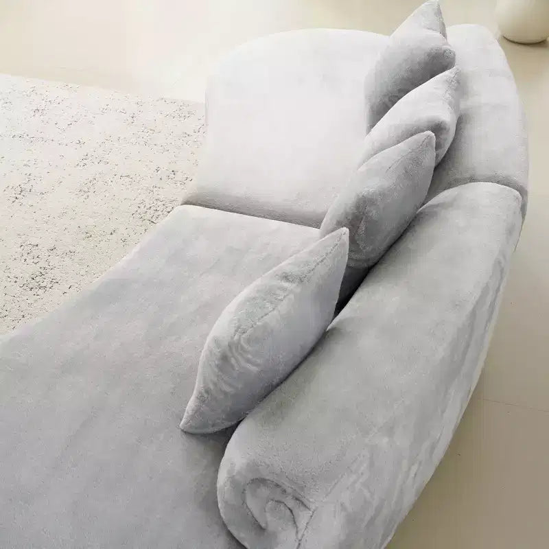 Modern and simple curved flannelette sofa. Creative multi-seater for the living room, with a combination of pillows.