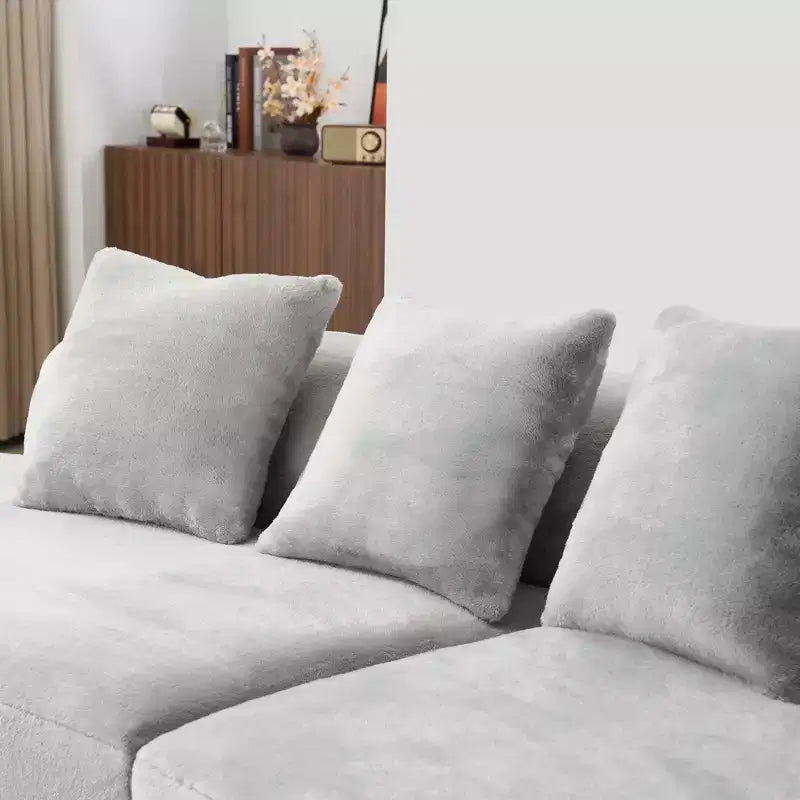 Modern and simple curved flannelette sofa. Creative multi-seater for the living room, with a combination of pillows.