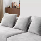 Modern and simple curved flannelette sofa. Creative multi-seater for the living room, with a combination of pillows.