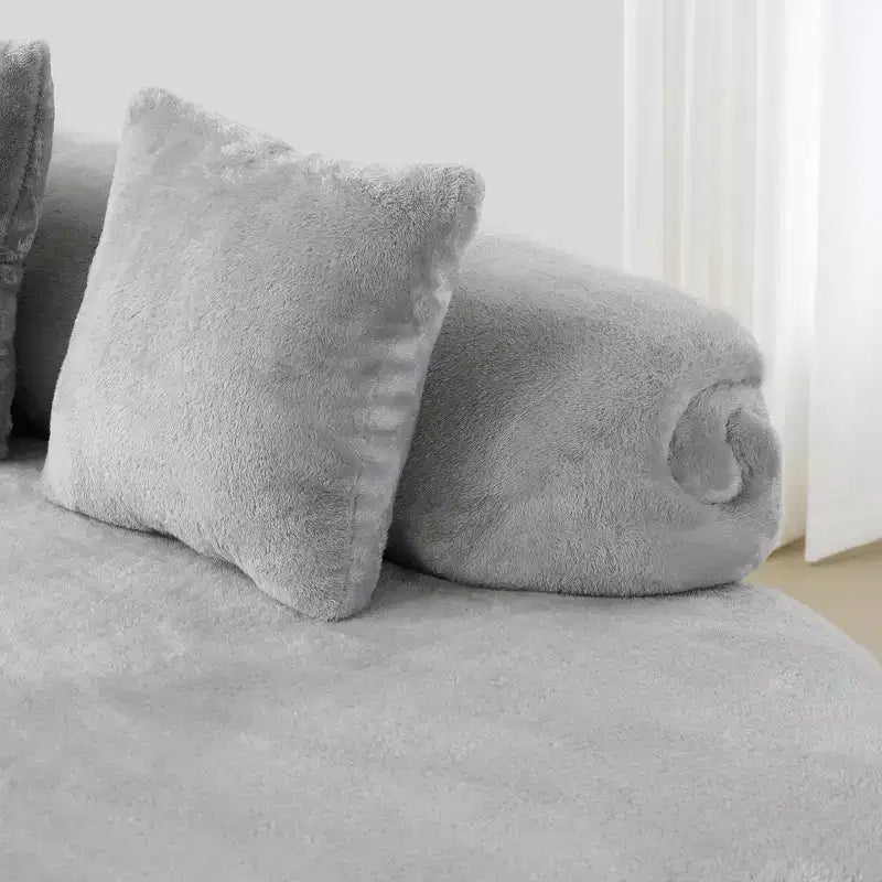Modern and simple curved flannelette sofa. Creative multi-seater for the living room, with a combination of pillows.
