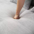 Modern and simple curved flannelette sofa. Creative multi-seater for the living room, with a combination of pillows.