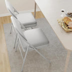 Lot de 4 chaises pliantes avec coussin et dossier rembourrés, supportent jusqu'à 158 kg